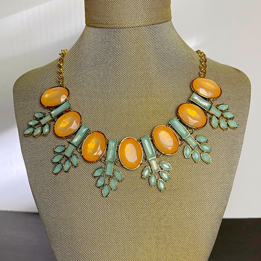 NWT Statement Necklace with matching earrings. Peach and Green in gold